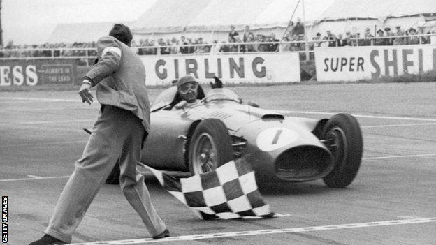 Juan Manuel Fangio wins the 1956 British Grand Prix in a Ferrari