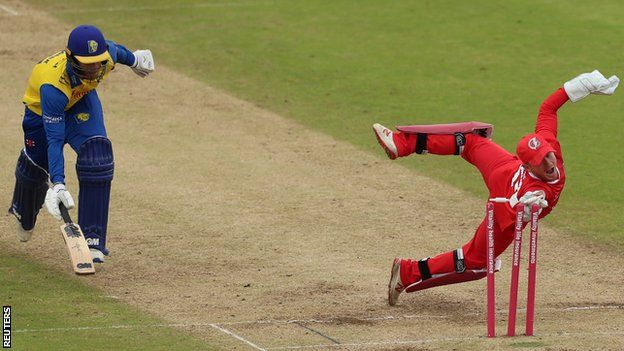 Lancashire's Alex Davies runs out Graham Clark of Durham