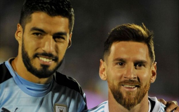 Uruguay's Luis Suarez (L) and Argentina's Lionel Messi