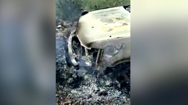 A burnt out car in Mexico, taken from mobile phone footage