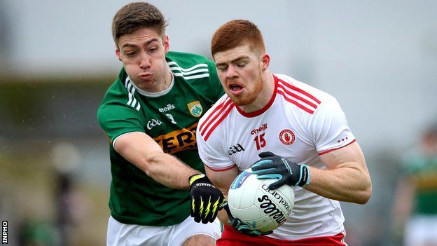 Kerry's Adrian Spillane battles with Tyrone's Cathal McShane in Killarney