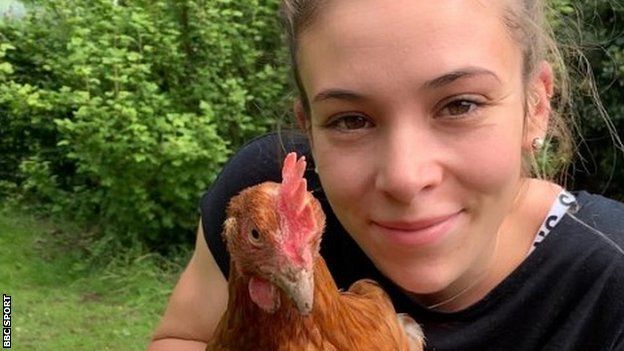 Sophie Coldwell with one of her chickens