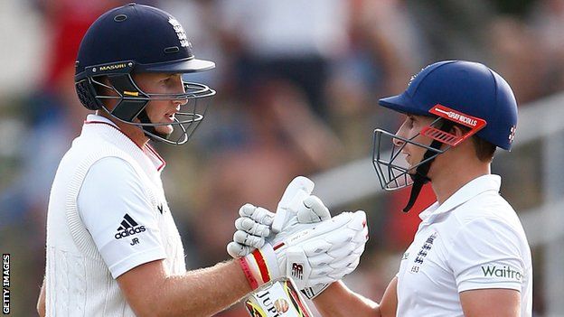 England batsman Joe Root (left) is congratulated on his fifty by James Taylor