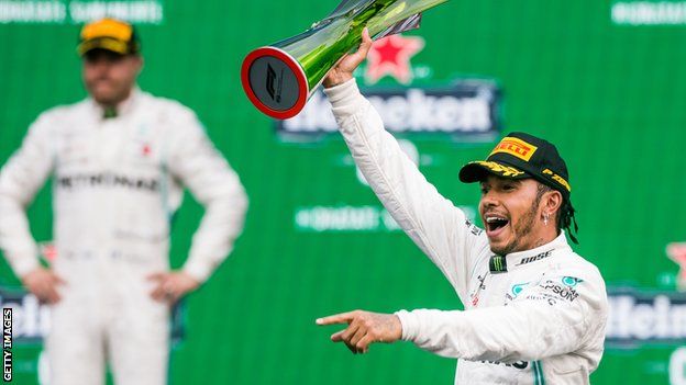 Lewis Hamilton celebrates after winning the Mexico Grand Prix