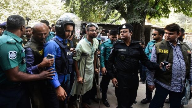Police escort detainees accused of allegedly plotting the Holey Artisan Bakery cafe attack