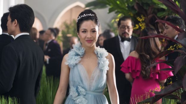 Movie still from Crazy Rich Asians showing Constance Wu smiling