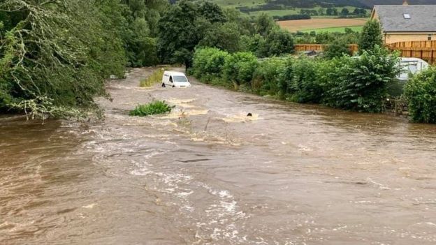 Floods in Otterburn as River Rede bursts banks - BBC News