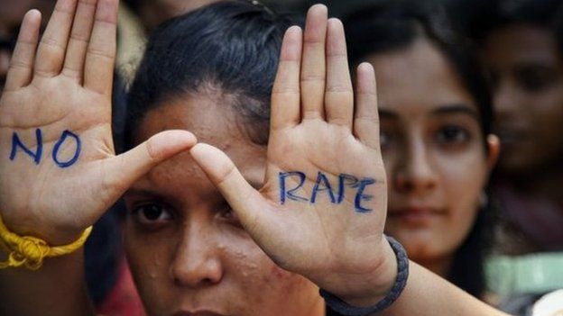 An Indian student displays "NO RAPE" message painted on her hands during a demonstration to demand death sentence for four men convicted of rape and murder of a student on a moving bus in New Delhi