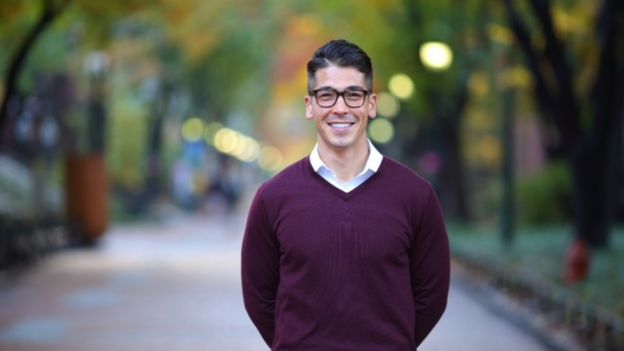 Alex Kubo standing in a street