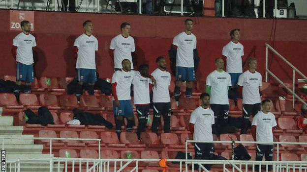 Norway players wear T-shirts saying 'Human rights on and off the pitch' prior to kick off against Gibraltar