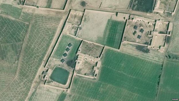 A zoomed-in satellite image shows the banks of solar panels in a farm in Helmand