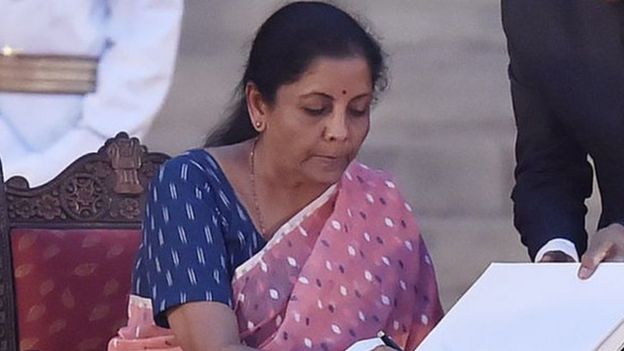 The Bharatiya Janata Party's Nirmala Sitharaman signs papers after taking oath as a cabinet minister during the swearing-in ceremony on May 30, 2019 in Delhi, India