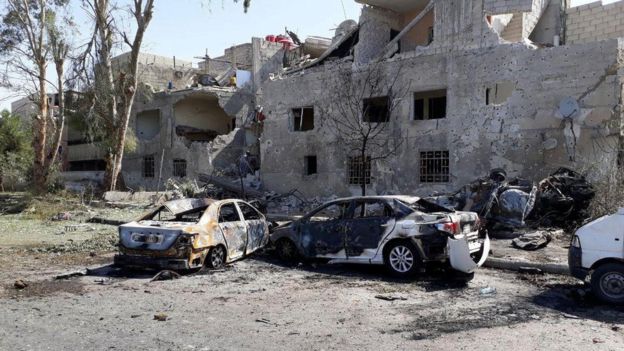Damaged cars are seen at one of the blast sites in Damascus in this handout picture posted on SANA on July 2, 2017