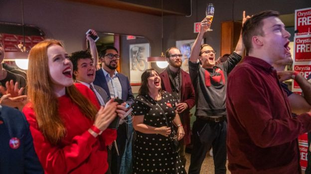 Liberal supporters cheer as election results begin to come in