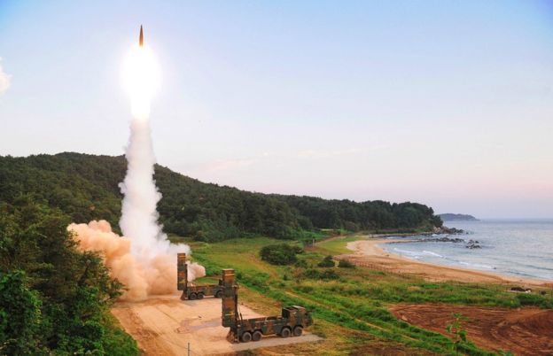 This handout photo taken on 4 September 2017 and provided by South Korean Defence Ministry in Seoul shows South Korea's missile system firing Hyunmu-2 missile into the East Sea from an undisclosed location on South Korea's east coast during a live-fire exercise simulating an attack on North Korea's nuclear site.