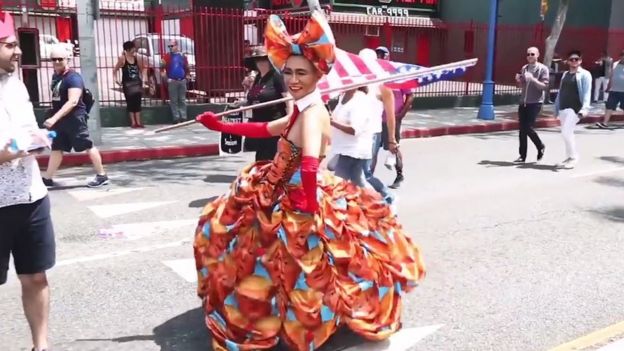 Drag queen waving a US flag