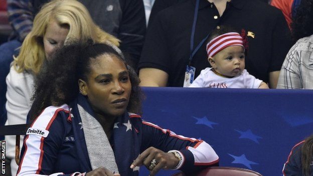 Serena Williams and her daughter watch the Fed Cup action