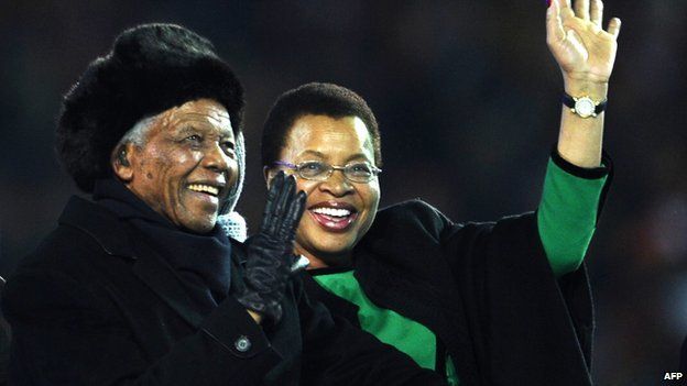 South Africa's former President Nelson Mandela and his wife Graca Machel on 11 July 2010 at Soccer City stadium in Soweto, suburban Johannesburg.