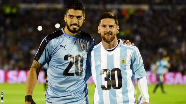 Uruguay's Luis Suarez and Barcelona team-mate Lionel Messi of Argentina pose for photos in special kits promoting the 2030 bid