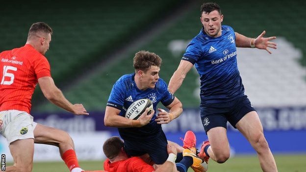 Leinster's Garry Ringrose is tackled by Munster's Andrew Conway