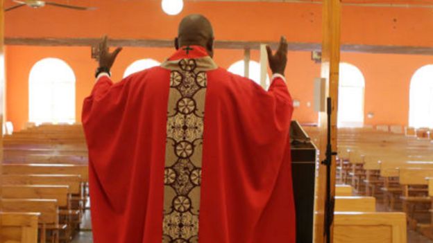 A priest in an empty church in South Africa