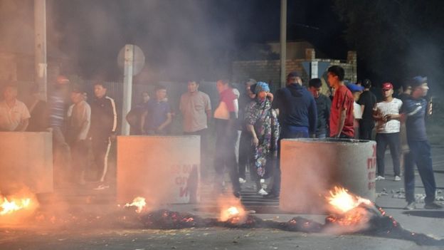 Supporters of Almazbek Atambayev blockade a street in the village of Koi-Tash as members of the Kyrgyz special forces undertake a special operation to detain ex-leader, on August 7, 2019