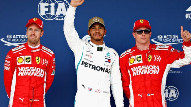 Ferrari's Sebastian Vettel and Kimi Raikkonen with Mercedes' Lewis Hamilton (centre)