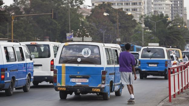 Minibus taxes on a street in Addis Ababa, Ethiopia