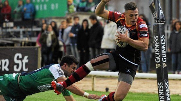 Dragons' Nick Scott is pushed into touch by Tiernan O'Halloran of Connacht