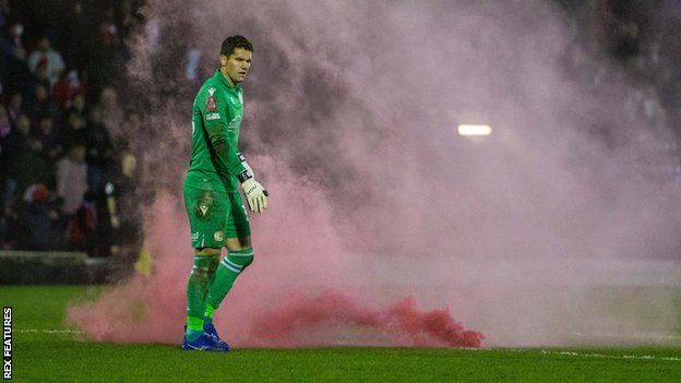 A fed flare went off in Reading keeper Rafael's goalmouth at Aggborough after what proved to be Kidderminster Harriers' winning goal