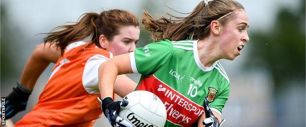 Sinead Cafferky of Mayo in possession as Aramagh's Colleen McKenna closes in