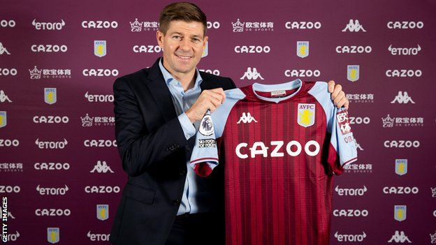 Steven Gerrard holds up an Aston Villa shirt