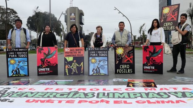 Activists gather to urge world leaders to take action against climate change in Lima, Peru on 8 September 2018.