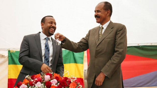Eritrea's President Isaias Afwerki receives a key from Abiy Ahmed as the Eritrean Embassy in Addis Ababa is re-opened in 2018