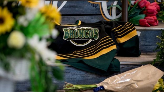 Memorial shows a Broncos shirt on a memorial in Humboldt
