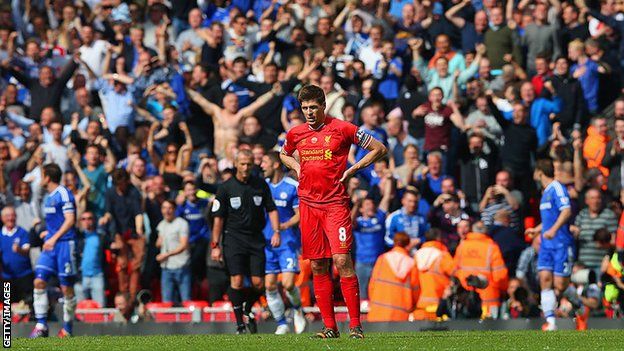 Steven Gerrard looks disconsolate in April 2014 after his slip against Chelsea