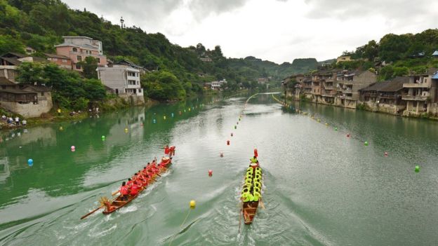 Teams compete during a dragon boat race in Huangping in China's southern Guizhou province in June 2017