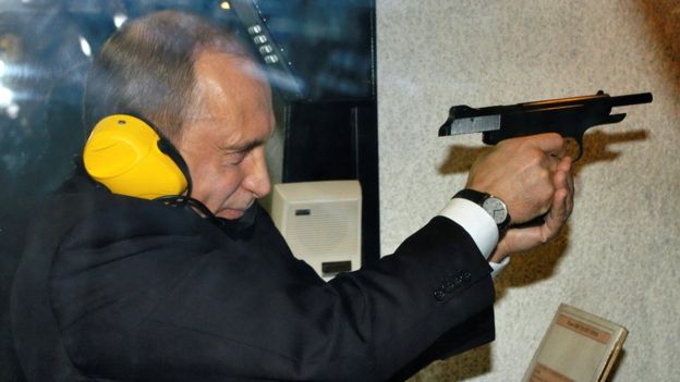 Vladimir Putin visits a shooting gallery of the new GRU military intelligence headquarters building in Moscow, 8 November 2006