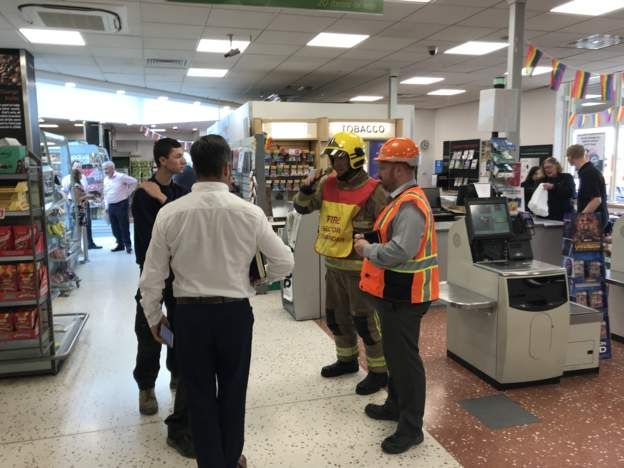 Emergency services inside with staff members