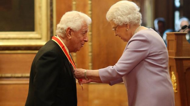 Sir Frank Lowry with the Queen at Windsor Castle investiture in December 2017