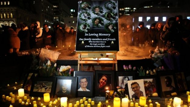 An altar with photographs of the victims who were killed in a plane crash in Iran is seen as people gather around to held a vigil in their memories on January 09, 2020 in Ottawa, Canada