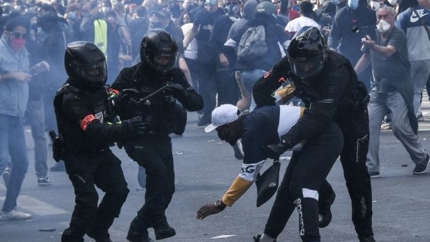 French riot police forces detain a protester during a rally as part of the "Black Lives Matter" worldwide protests against racism and police brutality, on Place de la Republique in Paris on 13 June 2020