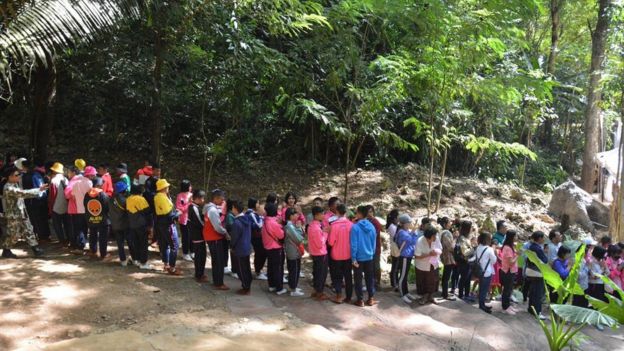 A handout photo made available by the Chiang Rai Provincial Public Relations Office shows people queuing to enter the Tham Luang cave in Mae Sai district, Chiang Rai province, Thailand, on 01 November 2019.