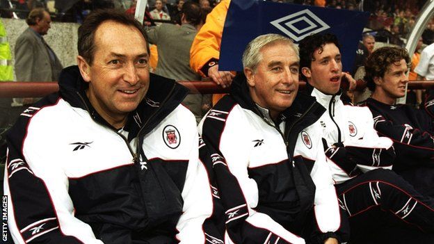 Gerard Houllier sits alongside Roy Evans