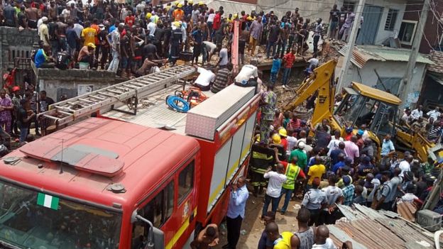 Rescuers search the rubble of a collapsed building in Lagos. 13 March 2019