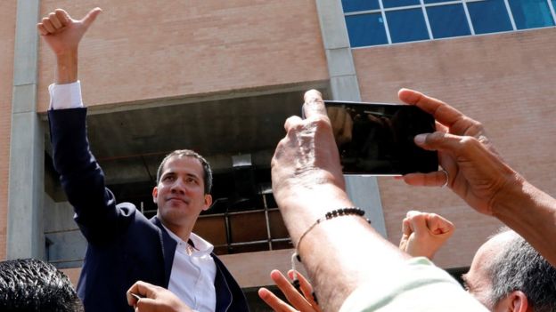 Venezuelan opposition leader Juan Guaid greets supporters after his arrival at the Simn Bolivar International airport in Caracas, Venezuela March 4, 2019