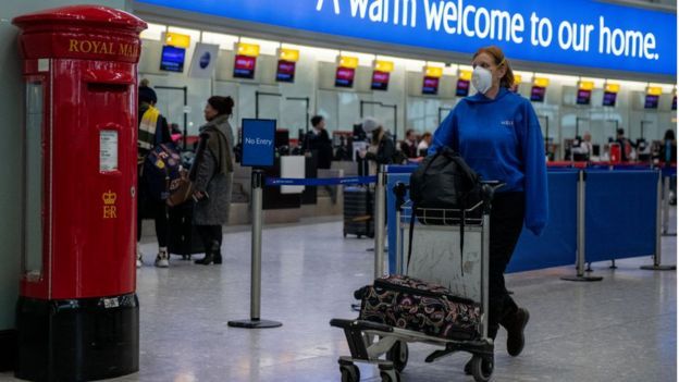 Woman travelling through Heathrow