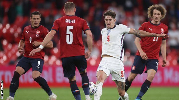 England's John Stones tackles Czech Republic's Vladimir Coufal
