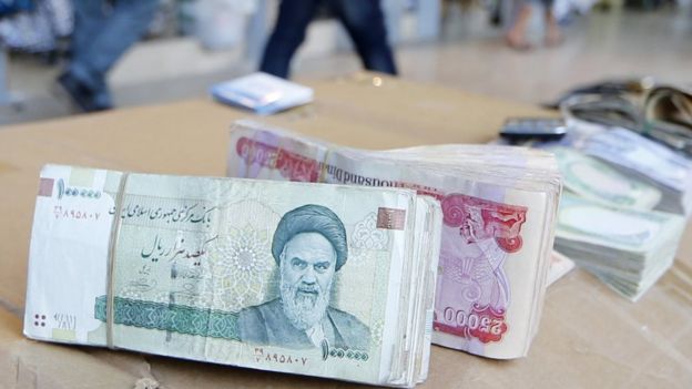 Iranian rial banknotes bearing a portrait of the late founder of the Islamic Republic of Iran, Ayatollah Ruhollah Khomeini, 19 June 2014
