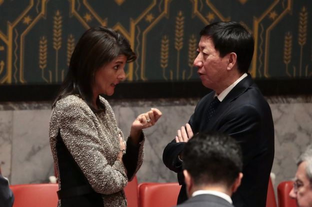 Nikki Haley (L) talks to China's Wu Haitao at the UN Security Council in New York, 29 November
